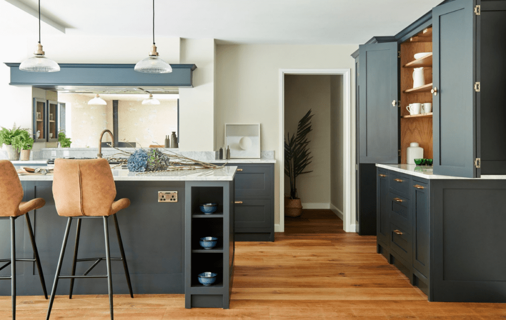 Dark blue kitchen island with shaker cabinetry