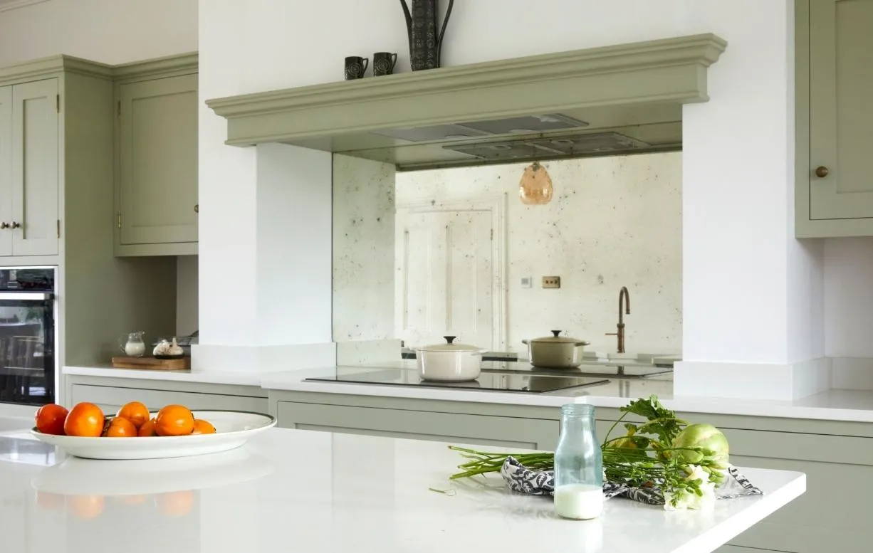 Neutral kitchen with mirrored backsplash