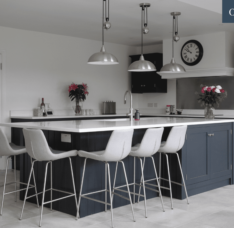 Grey and blue kitchen island with breakfast bar